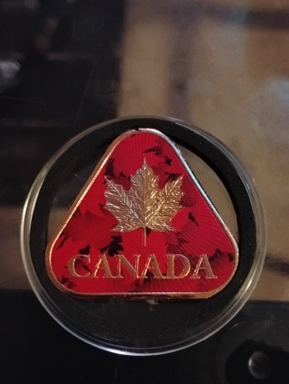 This piece is a Canada Maple Leaf & Canadian Flag 1 oz Colorized Copper Bullion